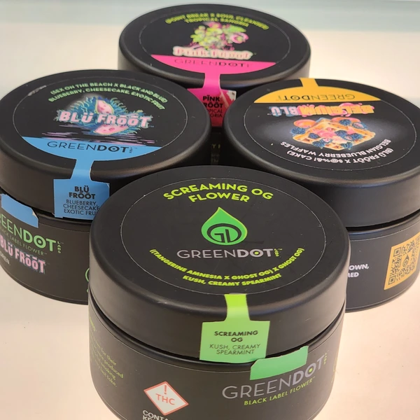 Four cannabis containers with colorful labels: "Blu Froot," "Screaming OG Flower," "Pink Rosé," and "Green Dot," showcasing various strains.